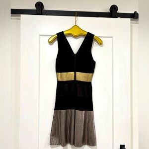 Parker sleeveless size medium. Black, gold and silver. Great condition.